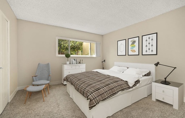 a bedroom with a bed and wallpaper on the wall