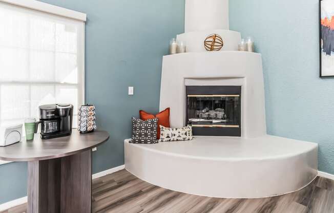 a living room with a fireplace and a coffee table