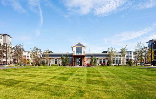 a large building with a lawn in front of it