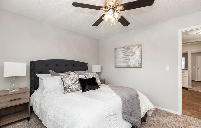 Bedroom with Plush Carpet and Ceiling Fan and Light