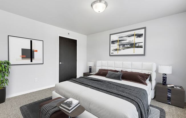 a bedroom with a large bed in a 555 waverly unit