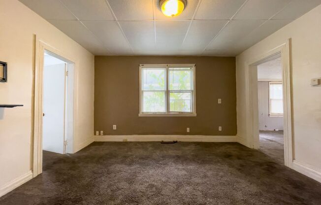 Fall into this cozy 3-Bedroom Home with a fenced in yard & detached garage!