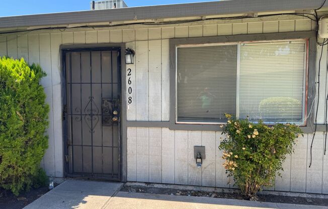Two Bedroom Triplex with One Bathroom and Garage