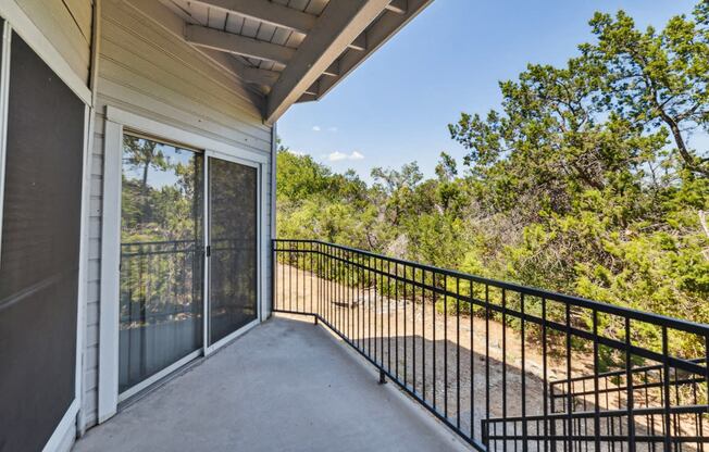 private balcony overlooking the woods