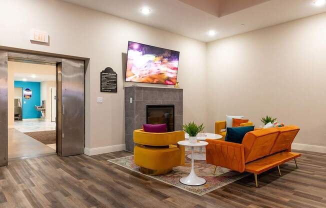 a living room with a fireplace and a tv