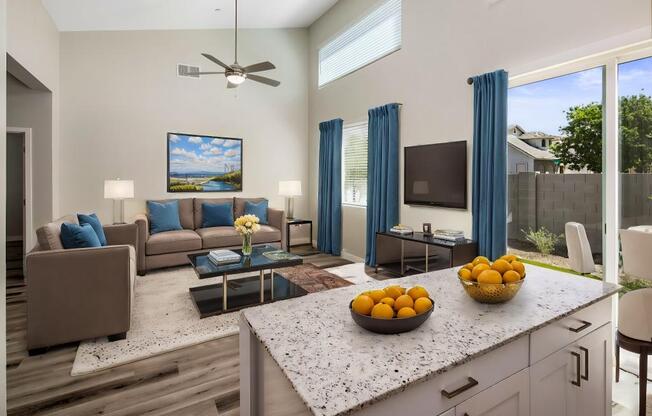 a living room with a couch and a table with fruits