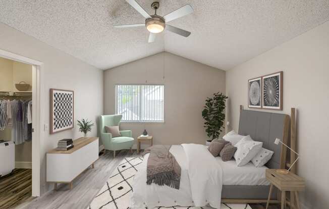 an open bedroom with a large bed and a ceiling fan