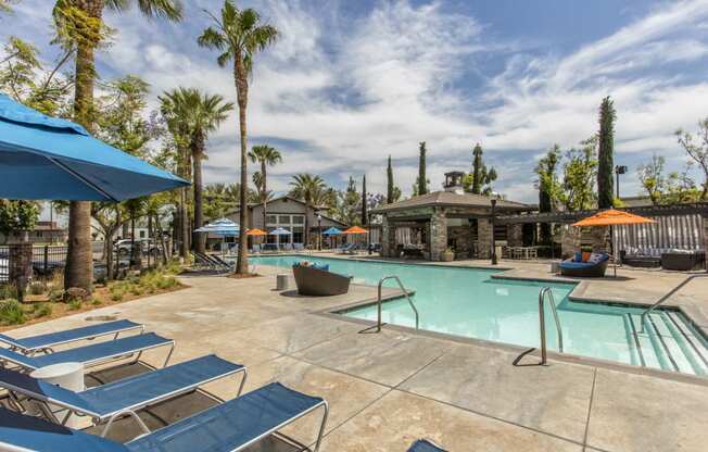 Outdoor pool area with lounge chairs