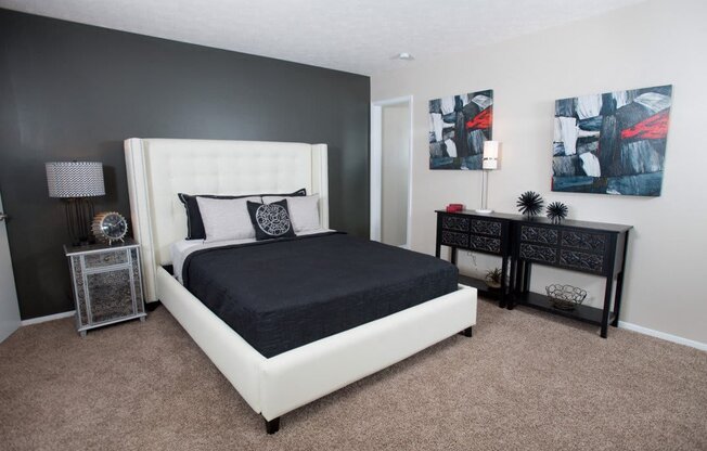 A bedroom with a large bed and two nightstands at Ridge Crossings Apartments, Alabama 35244
