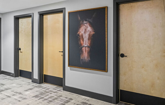 a painting of a horse hangs on a wall in a hallway at Madison Prickett Preserve, Yardley Pennsylvania