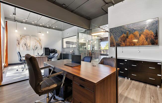 a home office with a desk and a large window at Troy Place Apartments - Troy, MI, Michigan