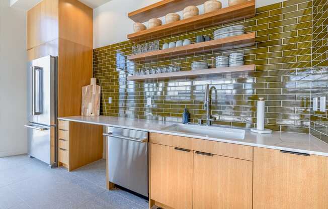 a kitchen with wood cabinets and stainless steel appliances at Marina Square, Bremerton, 98337
