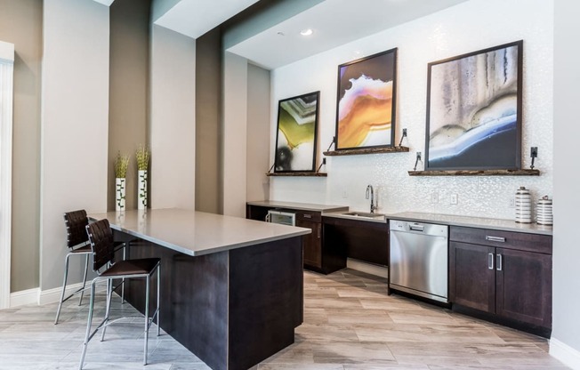 Community kitchen with wood-style flooring, microwave, sink, and dishwasher