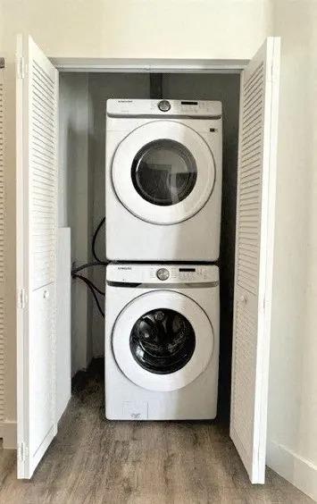 a washing machine and a dryer in a closet