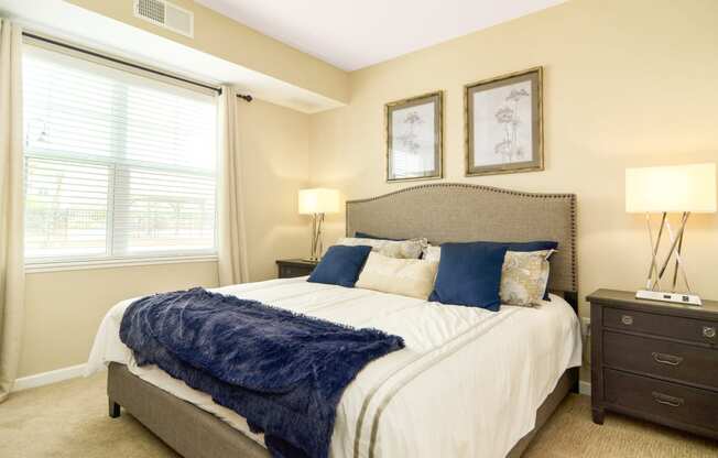 one of the bedrooms at the enclave at woodbridge apartments in sugar land, tx