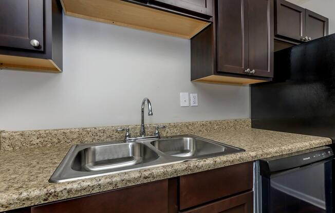 a kitchen with a stove a sink and a microwave