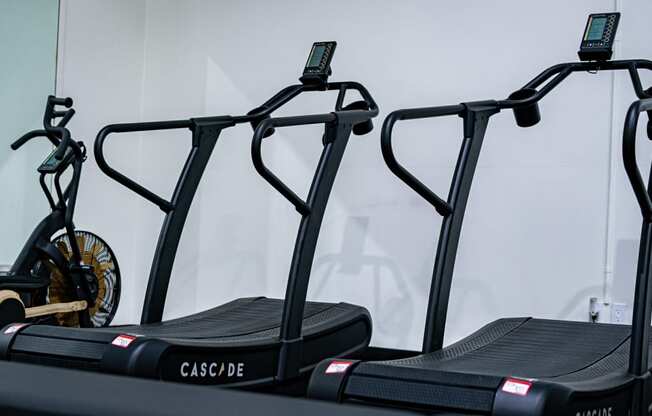 a pair of treadmills in a gym