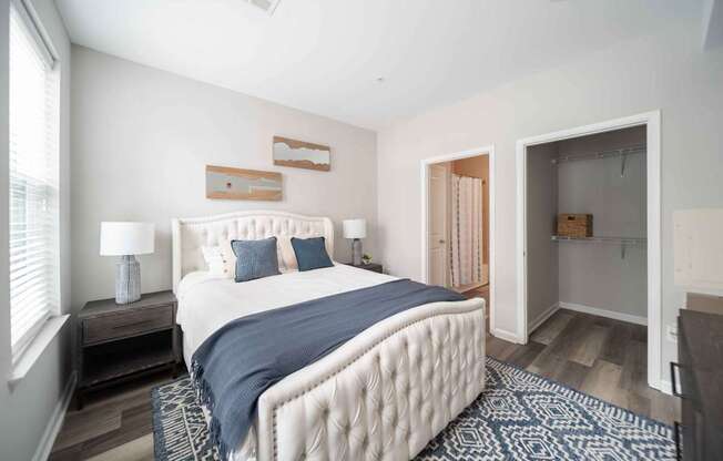 a bedroom with a bed and a closet at Harbor Pointe, Bayonne, 07002