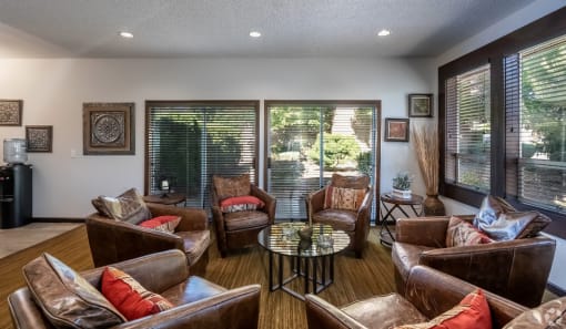 a living room with couches and chairs and a table