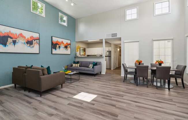 a living room and dining room with couches and chairs and a table