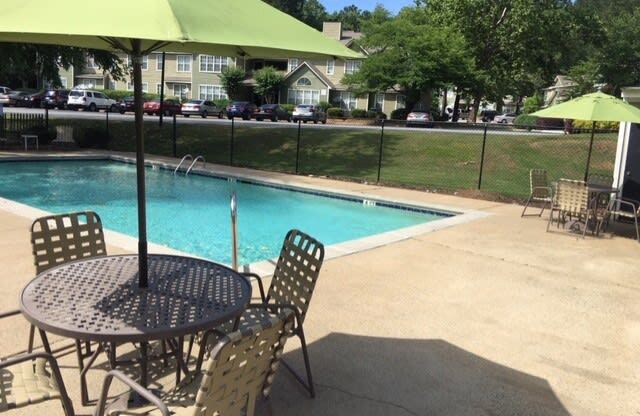 Twin Springs Apartments, Norcross Georgia, beautiful swimming pool with green umbrellas