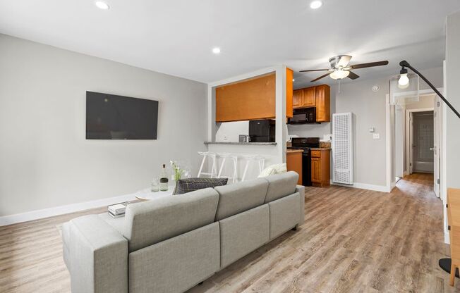 a living room with a couch and a tv