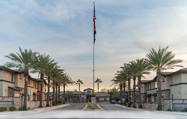 a flag pole with an american flag at the end of a street