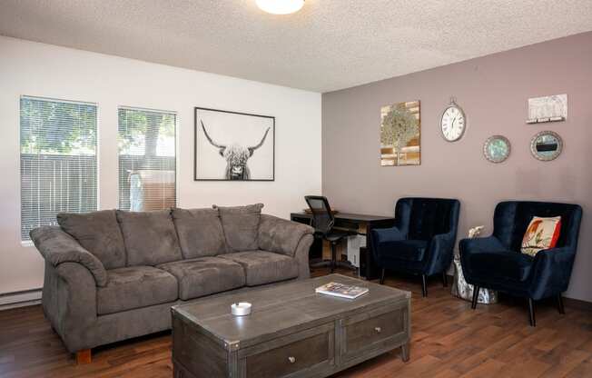 a living room with a couch and a table and chairs