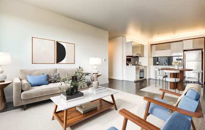 A modern living room with a white couch and a coffee table.