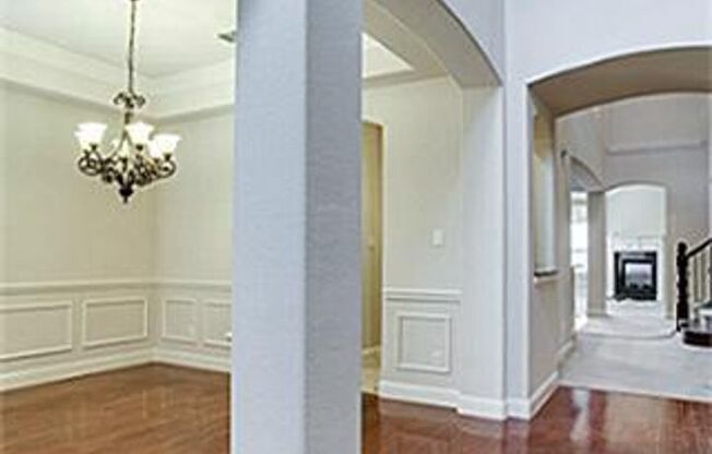 Bright and airy living room, fireplace, study, custom lighting in the formal living and dining.