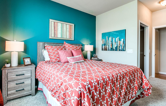 a bedroom with a bed and two night stands