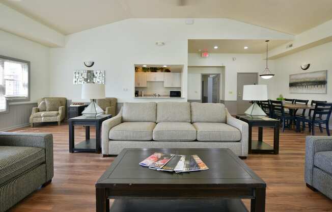 a living room with a couch and a coffee table at Heatherwood Apartments, Grand Blanc