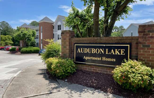a sign that says audubon lake apartment homes