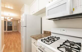 Kitchen with White Appliances and White Cabinets