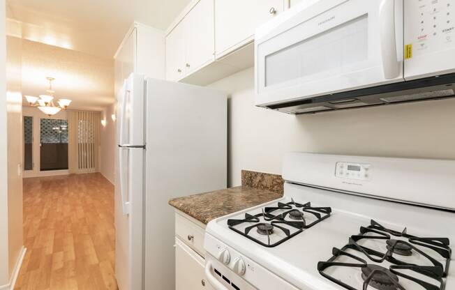 Kitchen with White Appliances and White Cabinets