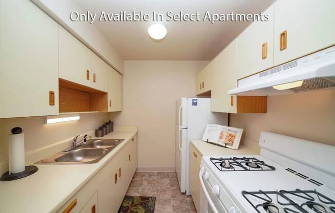 White Appliances and Almond Cabinets at Fairlane Apartments, Michigan