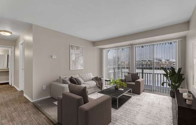 A living room with a couch, chairs, and a coffee table.