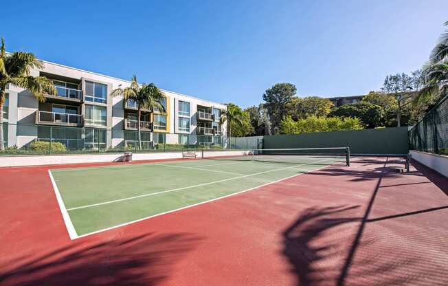 a tennis court with apartments in the background  at Marina Harbor, California, 90292