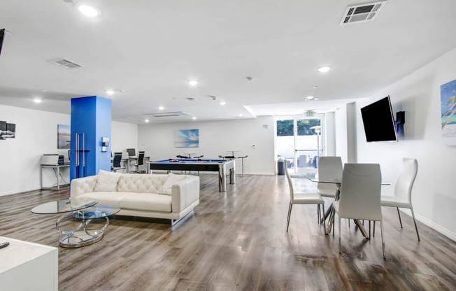 a living room and dining room with a pool table