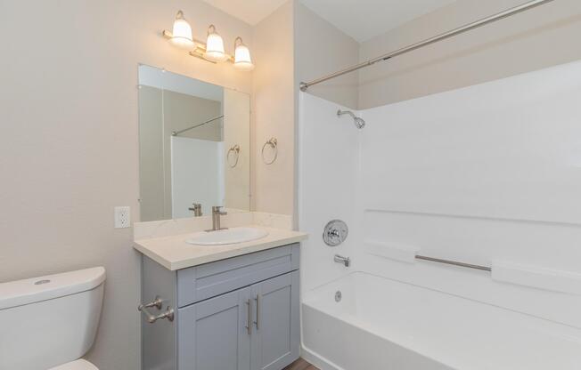 a room with a sink and a mirror