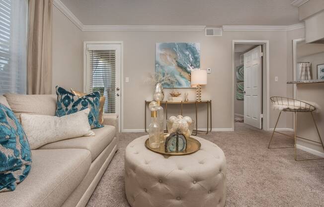 a living room with a couch and a at Highland Ridge Apartments, Overland Park , Kansas