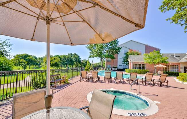 Enjoy a cool swim or warm up in our spa with golf course views at Turnberry Isle Apartments in Dallas, TX offers 1,2 and 3 Bedroom Apartment Homes.