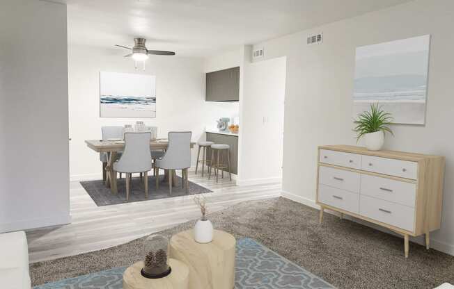 Living room opens into the dining area with a ceiling fan and breakfast bar on the right. Staged with dining set and wall art.at Summit, Idaho, 83201