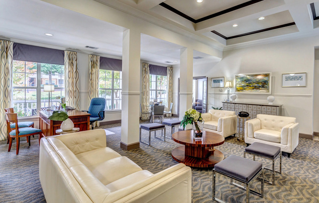 View of Resident Lounge, Showing Seating Area, Desk, and Chairs at Summer Park Apartments