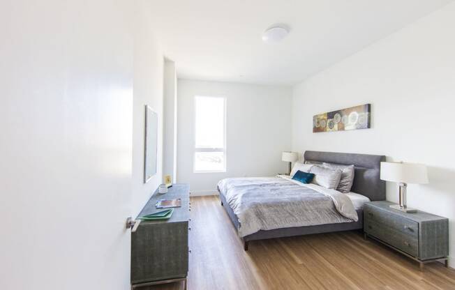 a bedroom with a bed and two night stands