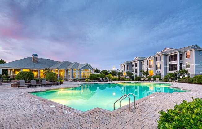 Courtney Station Apartments - Resort-style pool at dusk