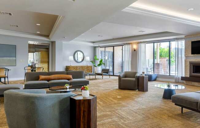 a large living room with couches and chairs and a fireplace at The Rays at Vegas Towers Apartments, Nevada, 89119
