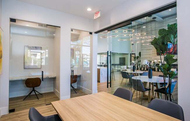 A conference room with a long table and chairs.