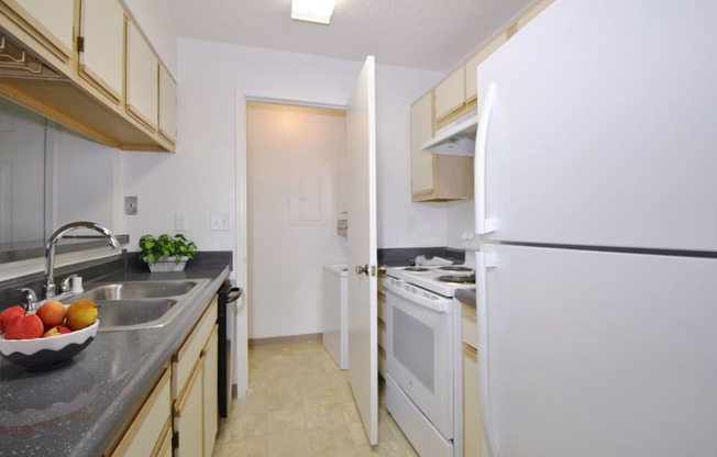 Southfield apartment kitchen with light cabinets