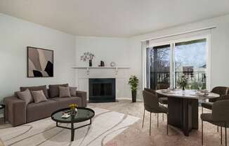 a living room with a couch and a table and a fireplace